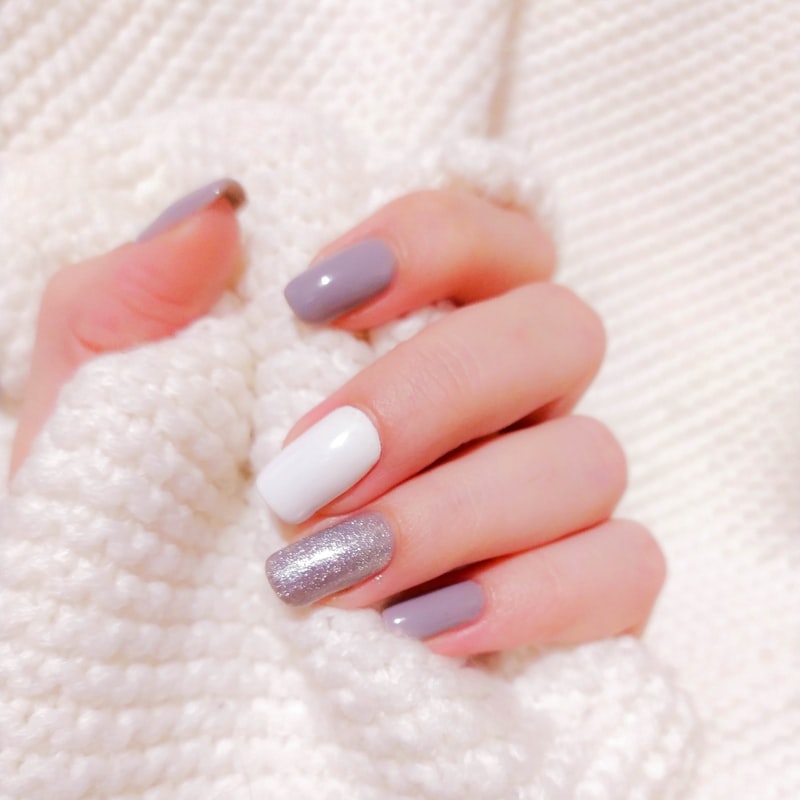 Custom nail art with glitter and gems